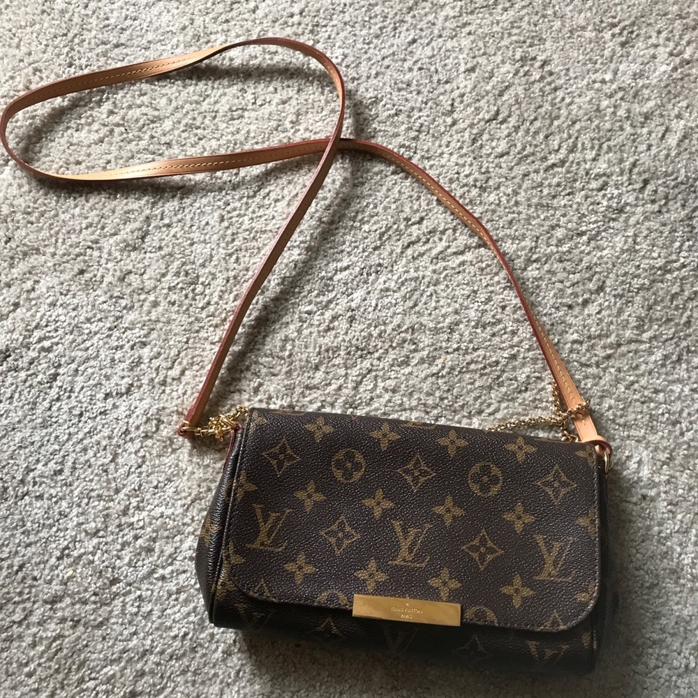 Authentic cross body bag by Louis Vutton